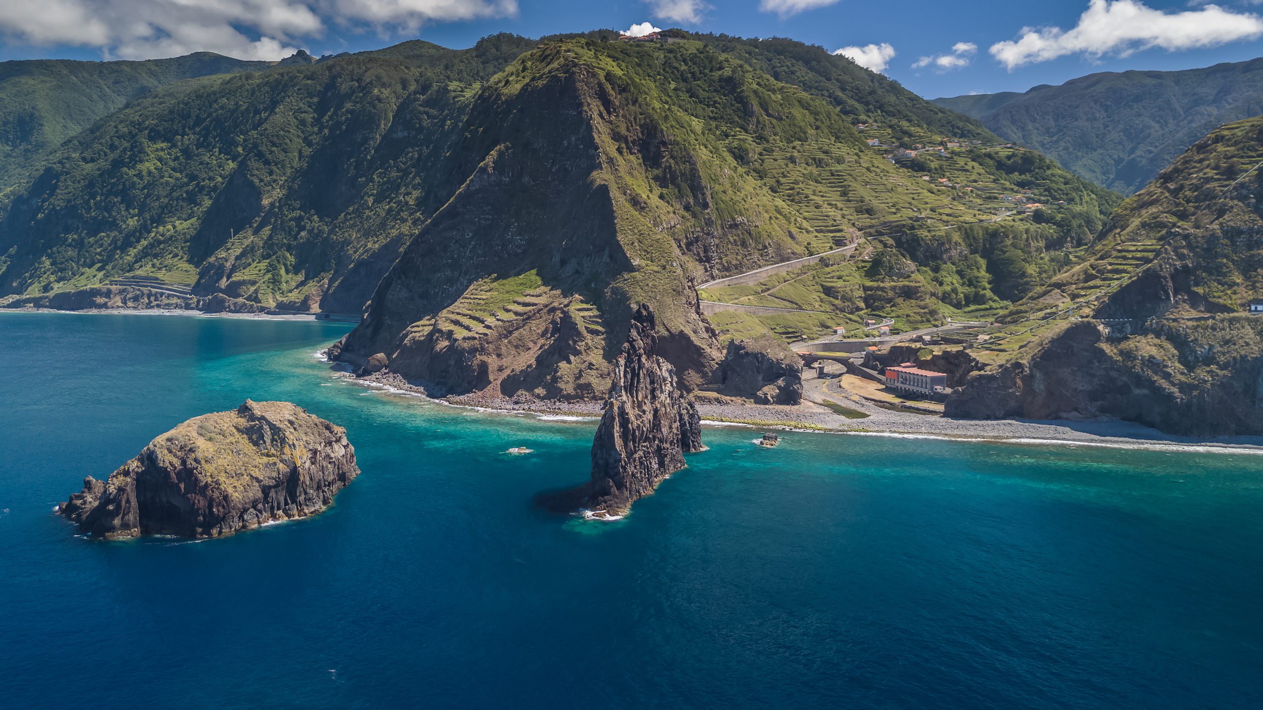 Madeira coastline with sea stack and green cliffs