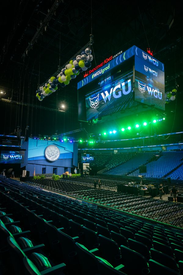 WGU commencement arena with stage and video screens