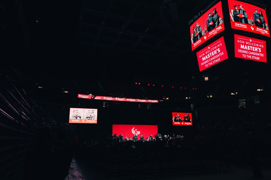 Arena scoreboard and IMAG screens welcoming graduates