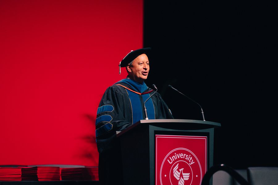 Speaker delivering the keynote at University of Phoenix commencement