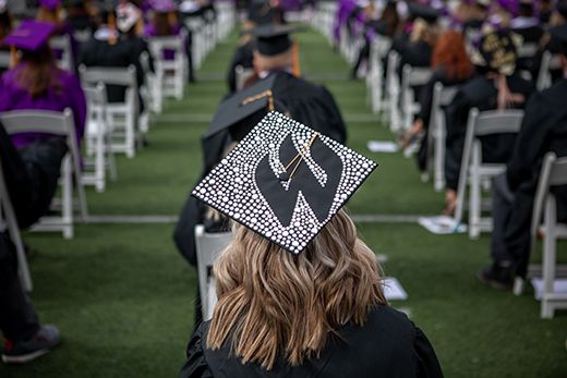 Weber State graduate with a decorated cap