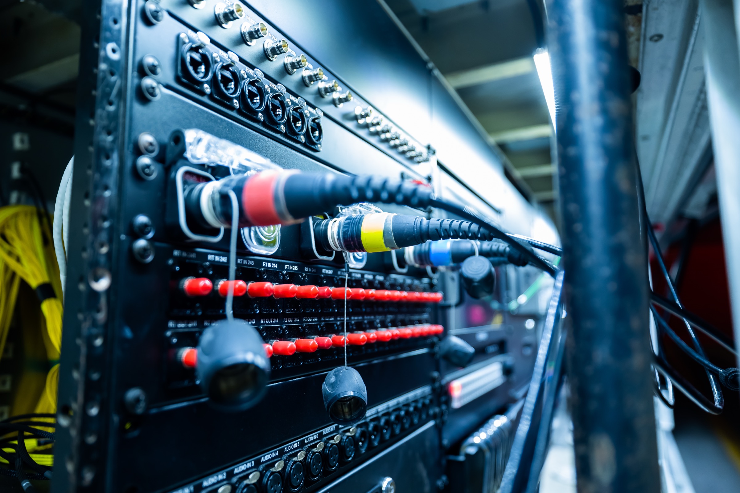Close-up of the large truck's patch panel with fiber, camera and audio lines connected