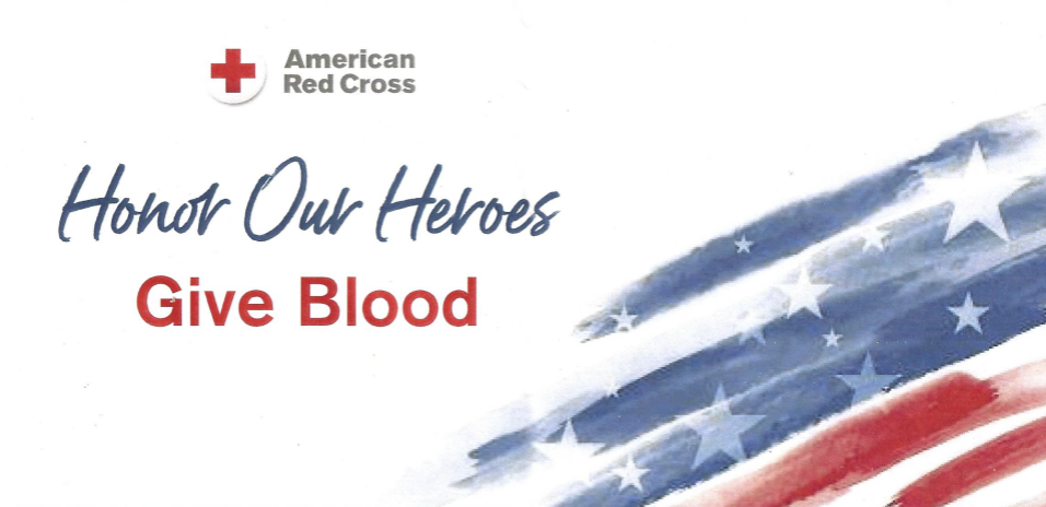 American Red Cross logo with "Honor Our Heroes" in blue script and "Give Blood" in red text, alongside a watercolor American flag design. Promotional banner encouraging blood donation.
