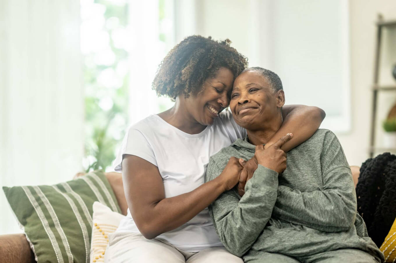 Older and younger women looking at a phone