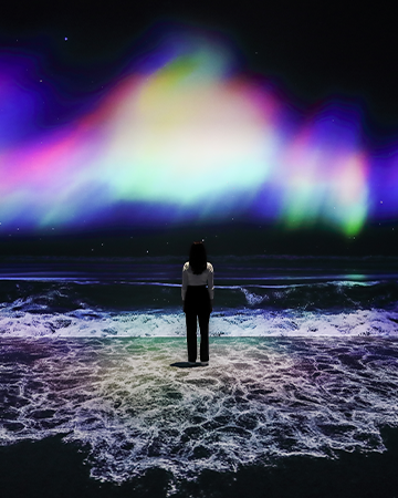 Witness the splendor of the aurora being at odds with the fierce waves