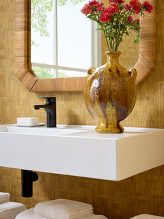 Wall preparation before wallpaper installation in a Maui bathroom