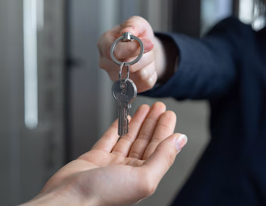 Landlord handing over property keys during ownership transfer in Dubai. Landlord handing over property keys during ownership transfer in Dubai.