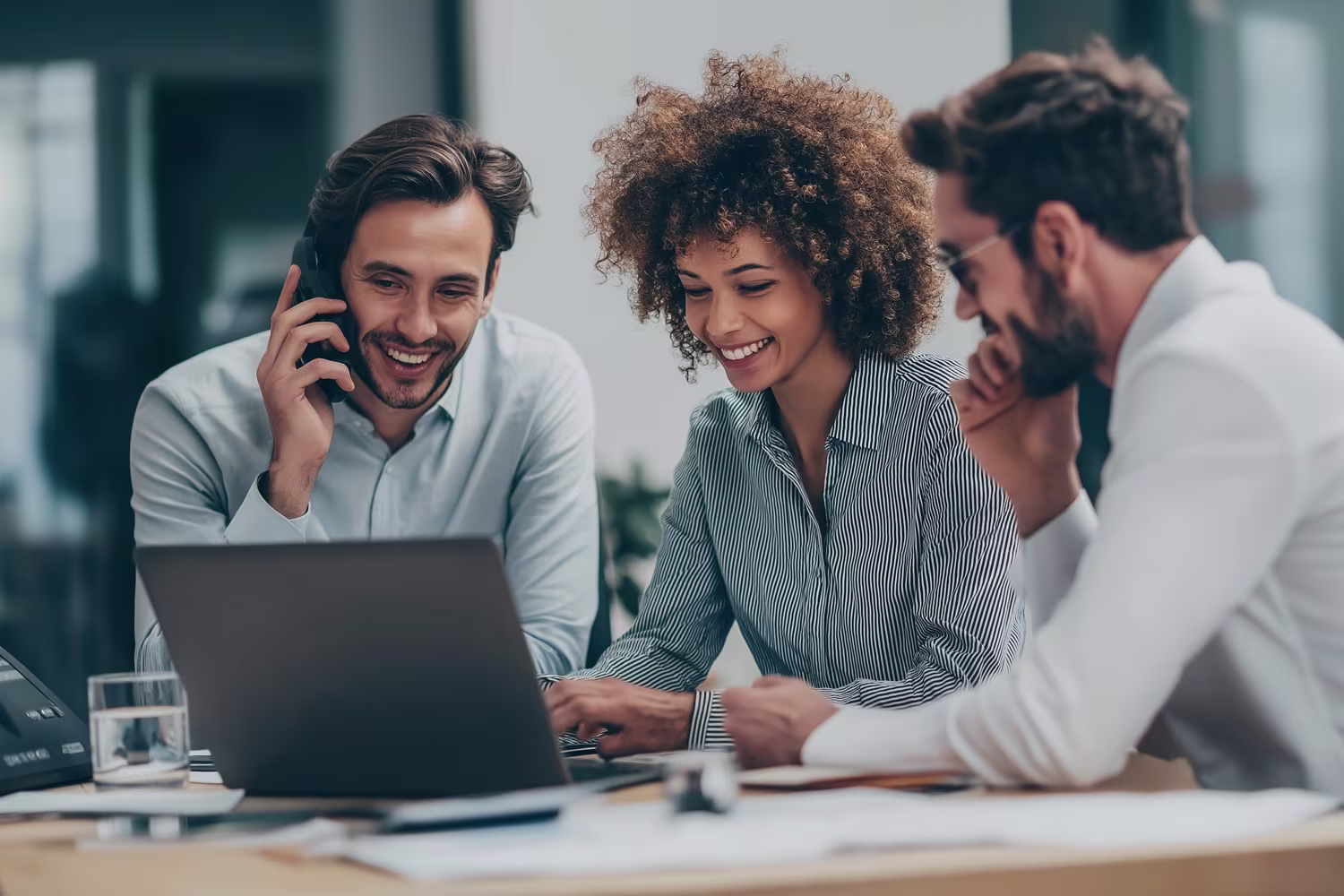 Diverse professionals discussing business VoIP solutions