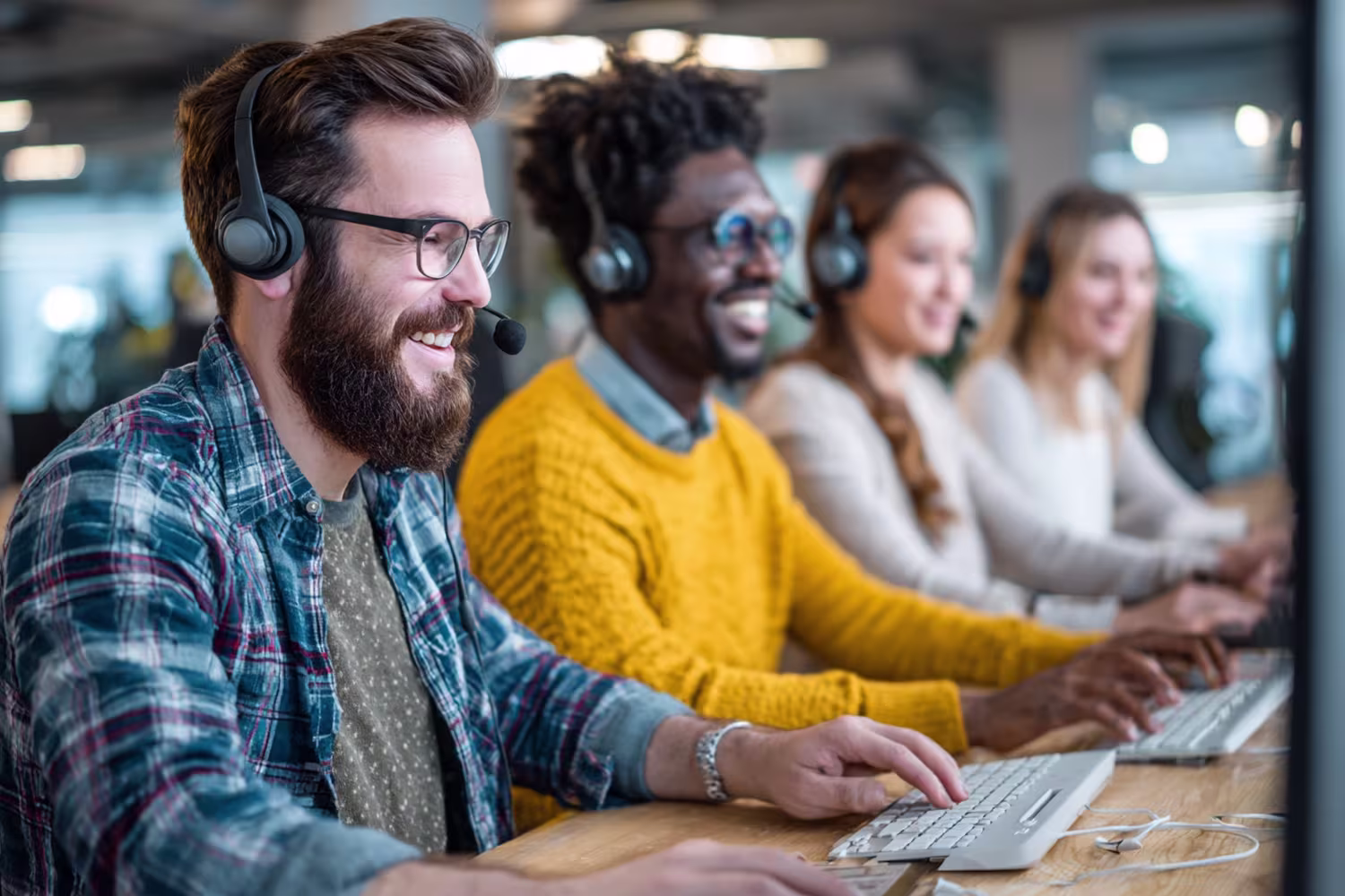 Diverse team collaborating on outsourced help desk solutions