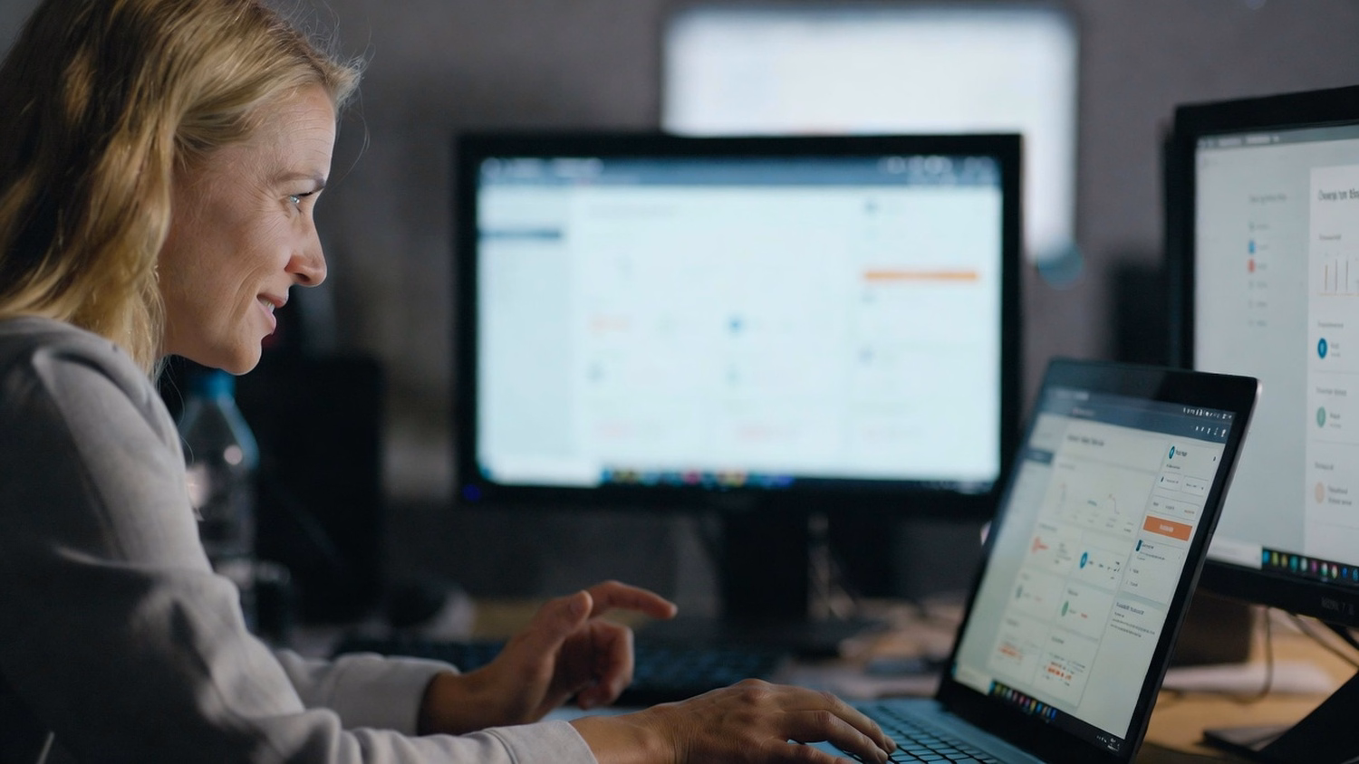 Woman taking cybersecurity quiz on laptop, focused on screen