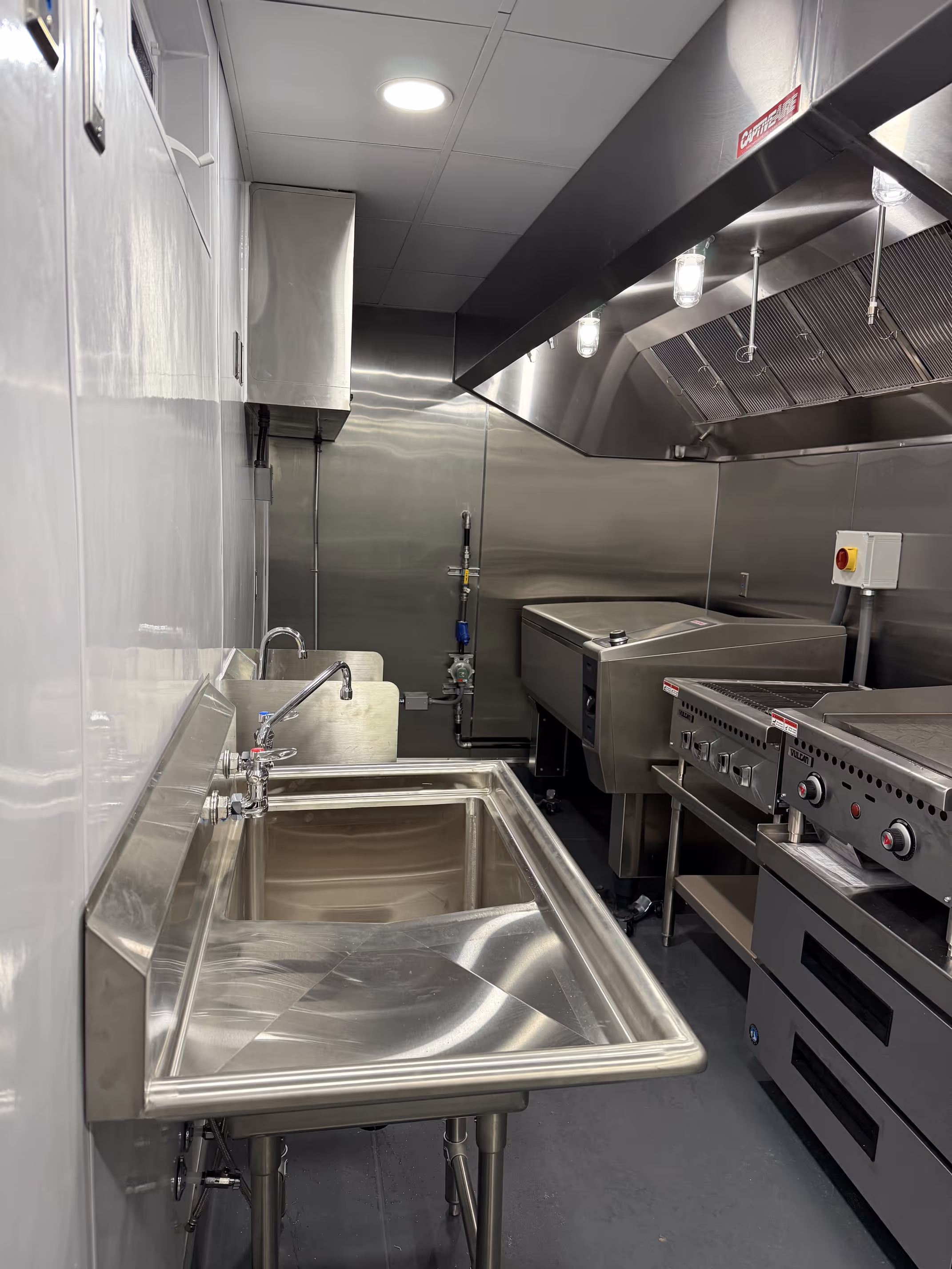 A mobile kitchen trailer interior, fully equipped