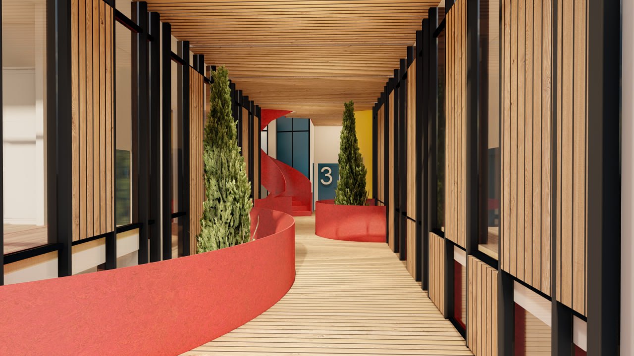 A wooden walkway leading to a building with a wooden deck.