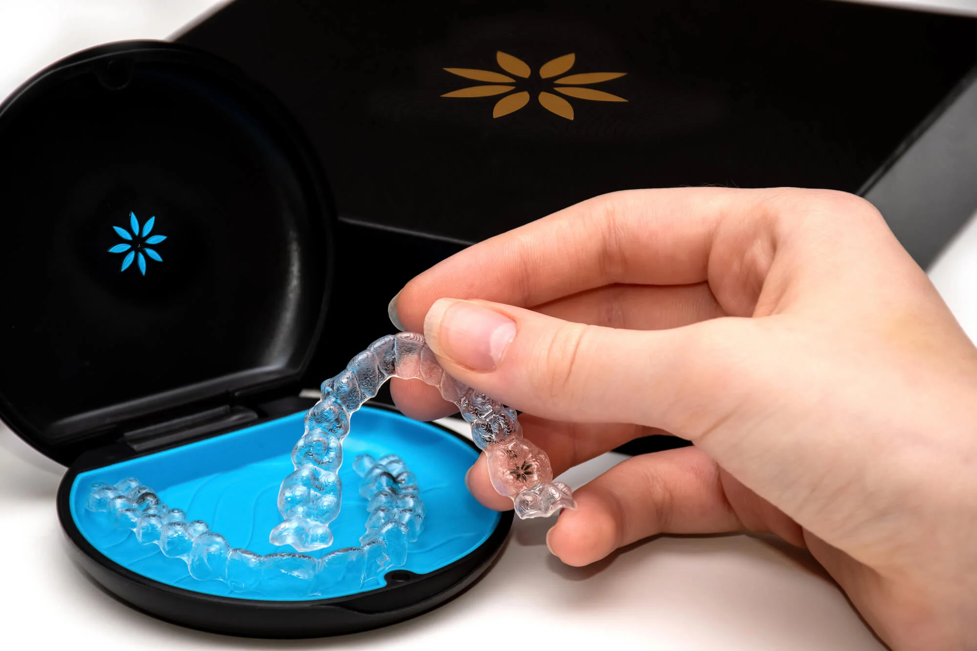 Invisalign Dentist Palm Beach Gardens checking an aligner