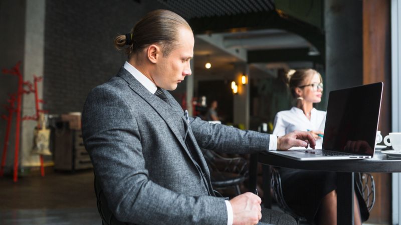An executive working on their laptop