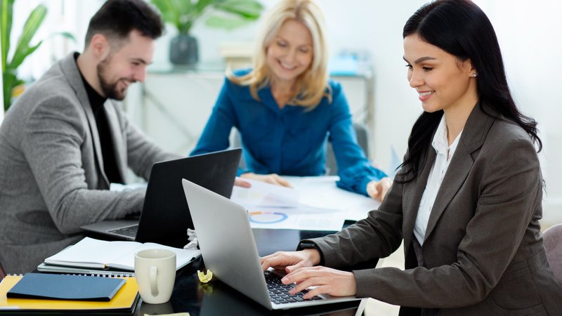 Consultant smiling while working on client projects