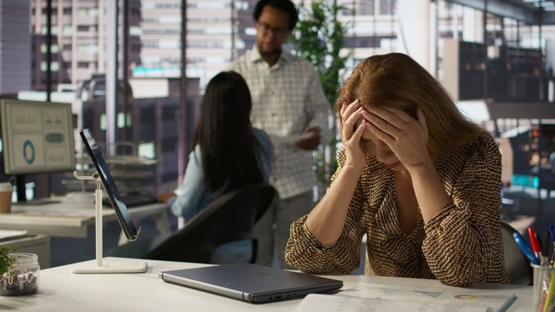 Overwhelmed employee experiencing burnout
