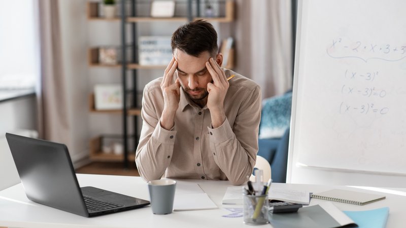 A man feeling unproductive at work