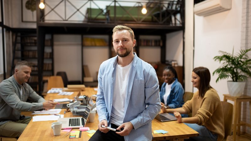 An agency CEO working with their team