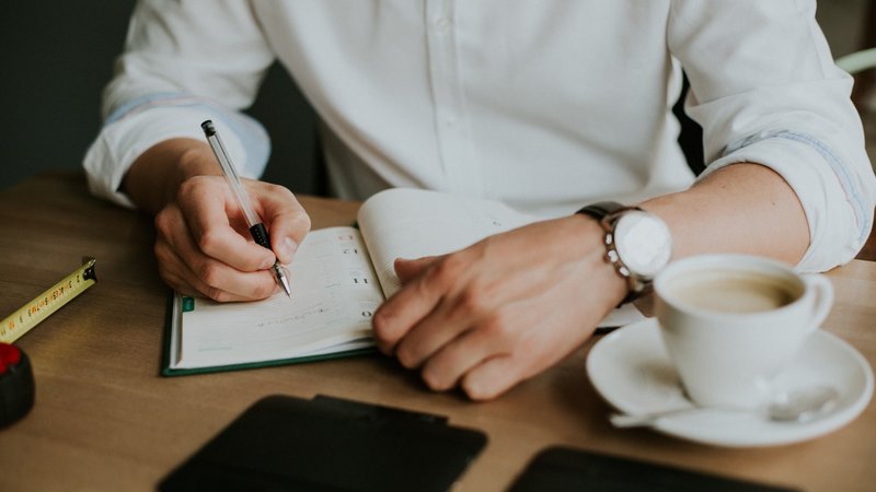 A man journaling at work