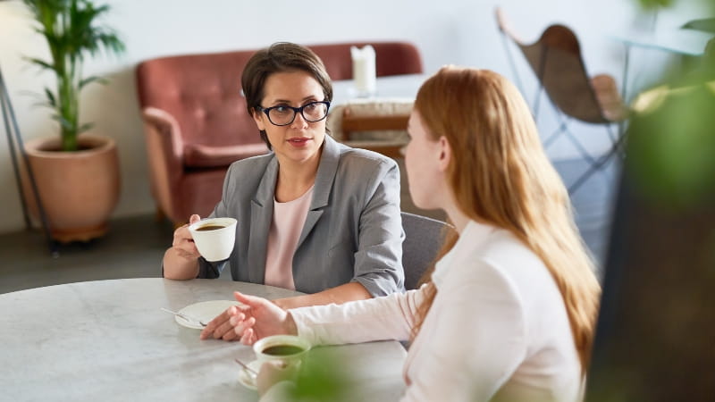 People discussing their time tracking data
