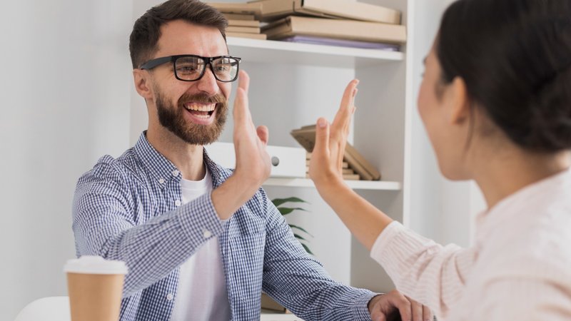 Sharing a high five with a client