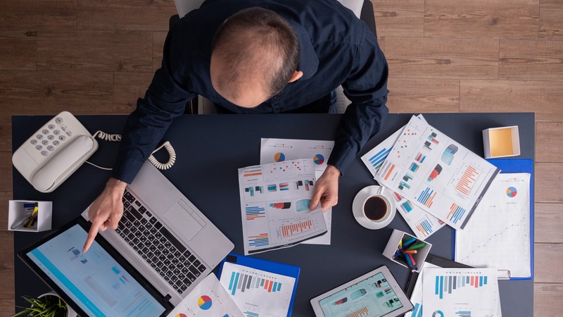 A financial advisor working at their desk