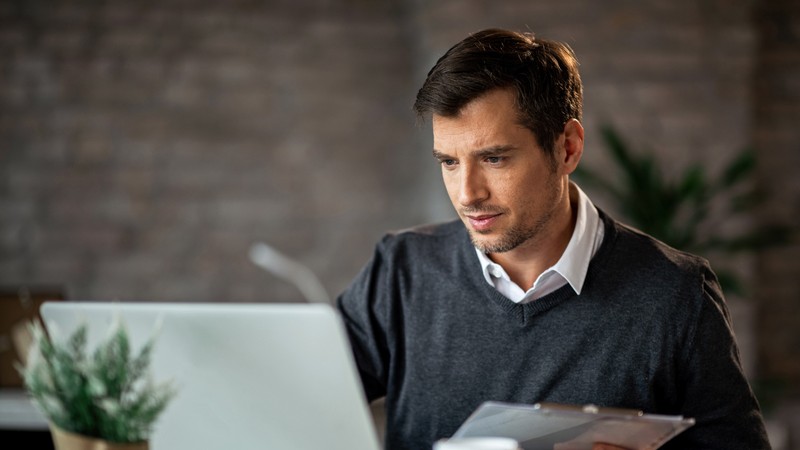Business owner checking financial reports