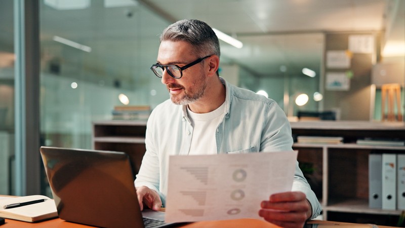 A consultant reading reports