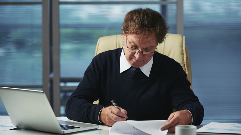 An attorney drafting a motion for summary judgment at their desk