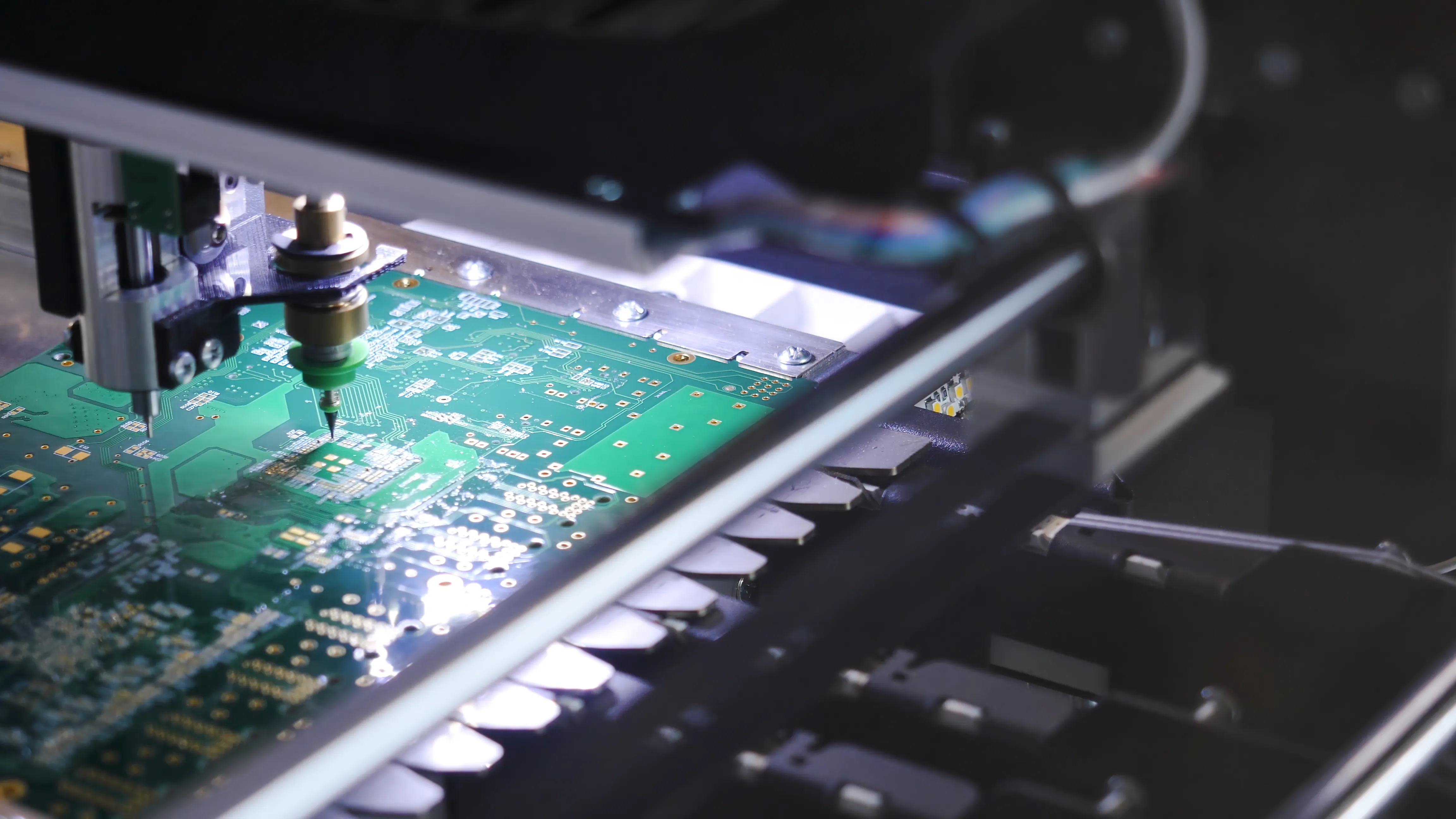 A close-up of a PCB during a quick-turn assembly process, with a machine precisely placing components on the board. This image highlights the speed and precision required for fast turnaround times in PCB manufacturing.