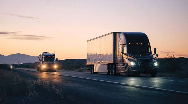 Trucks on highway at night