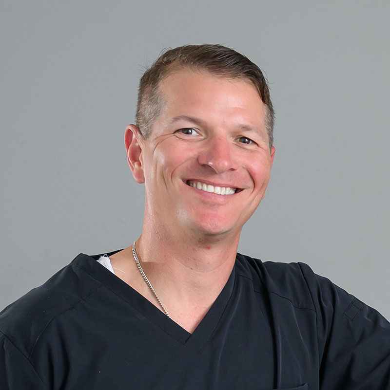 Chiropractor Dr. Scott LeBlanc portrait, smiling.