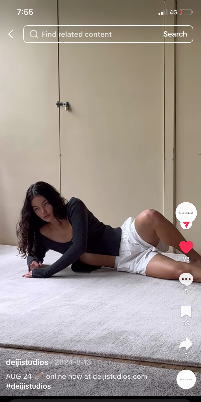 female model lays on carpeted floor in TikTok for Deiji Studios