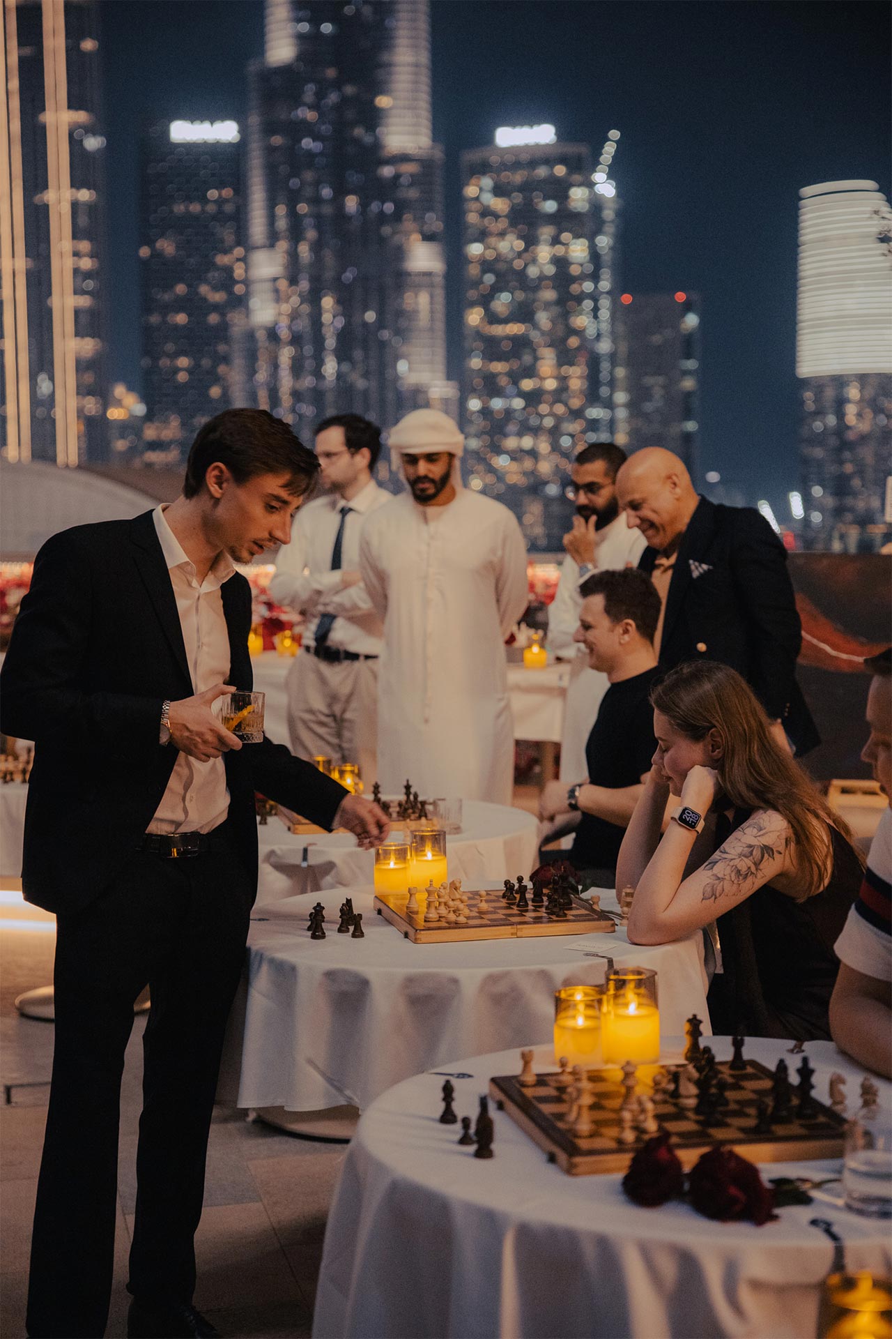 Guests playing chess on a Dubai rooftop at a FERZ night
