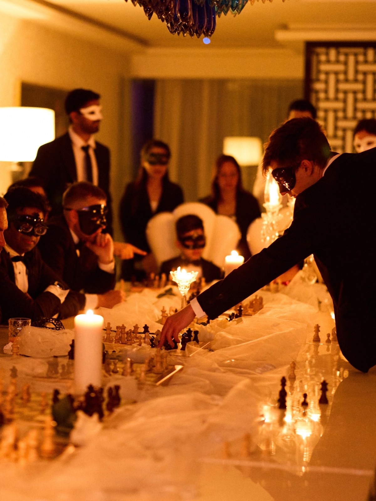 Simultaneous chess exhibition at a FERZ masquerade night