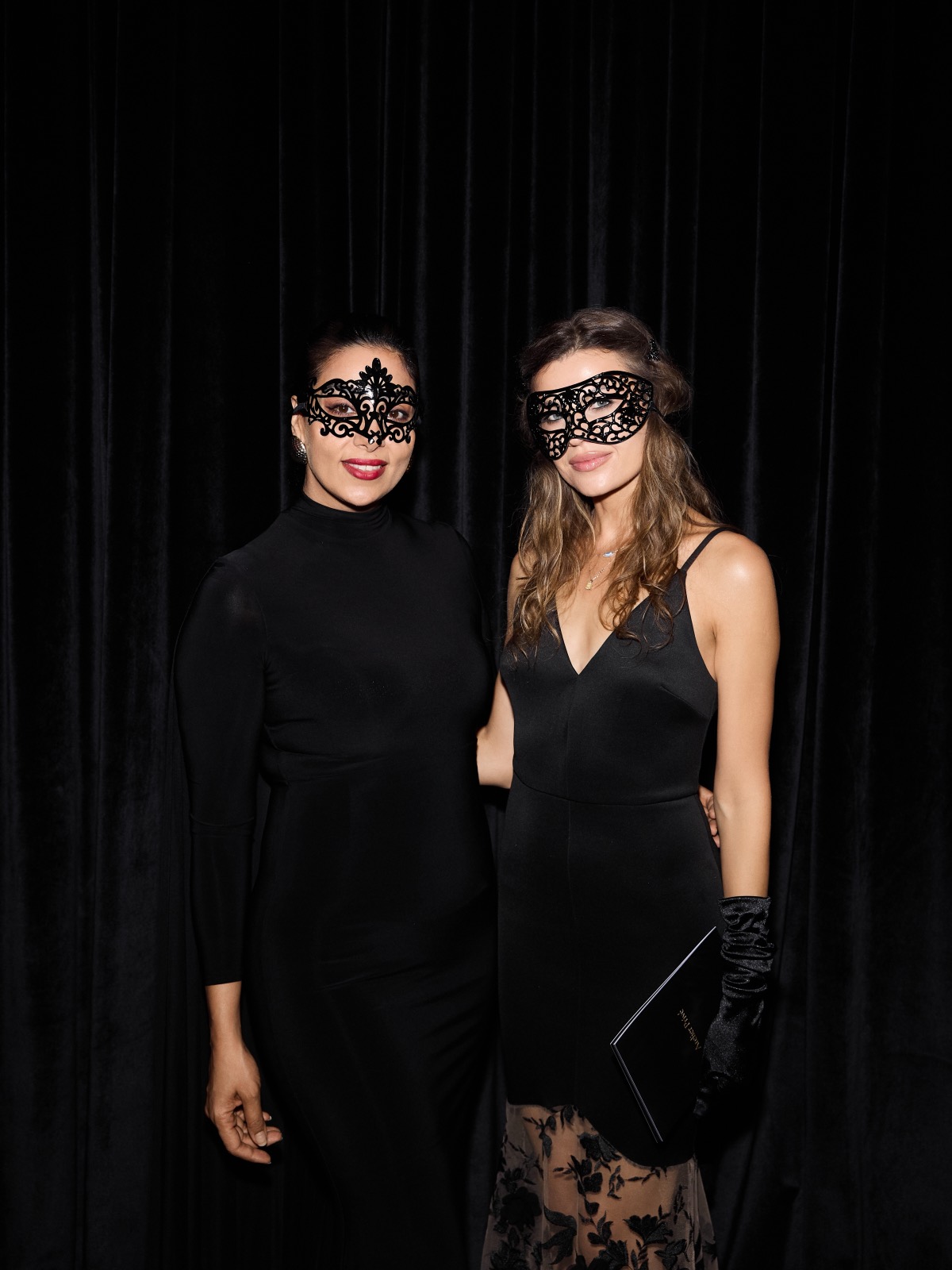 Guests in masks at a FERZ masquerade chess night