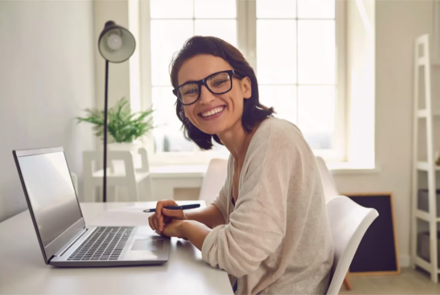 A woman working on her laptop.