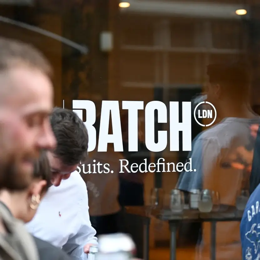 Batch London sustainable suits logo with their shop in the background