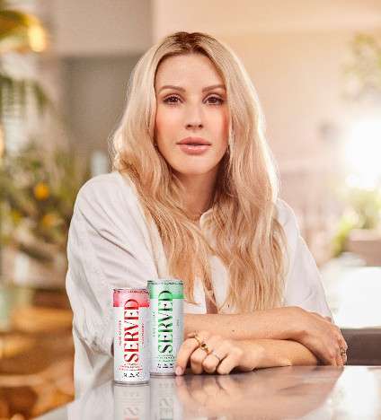 Ellie Goulding with a can of Served