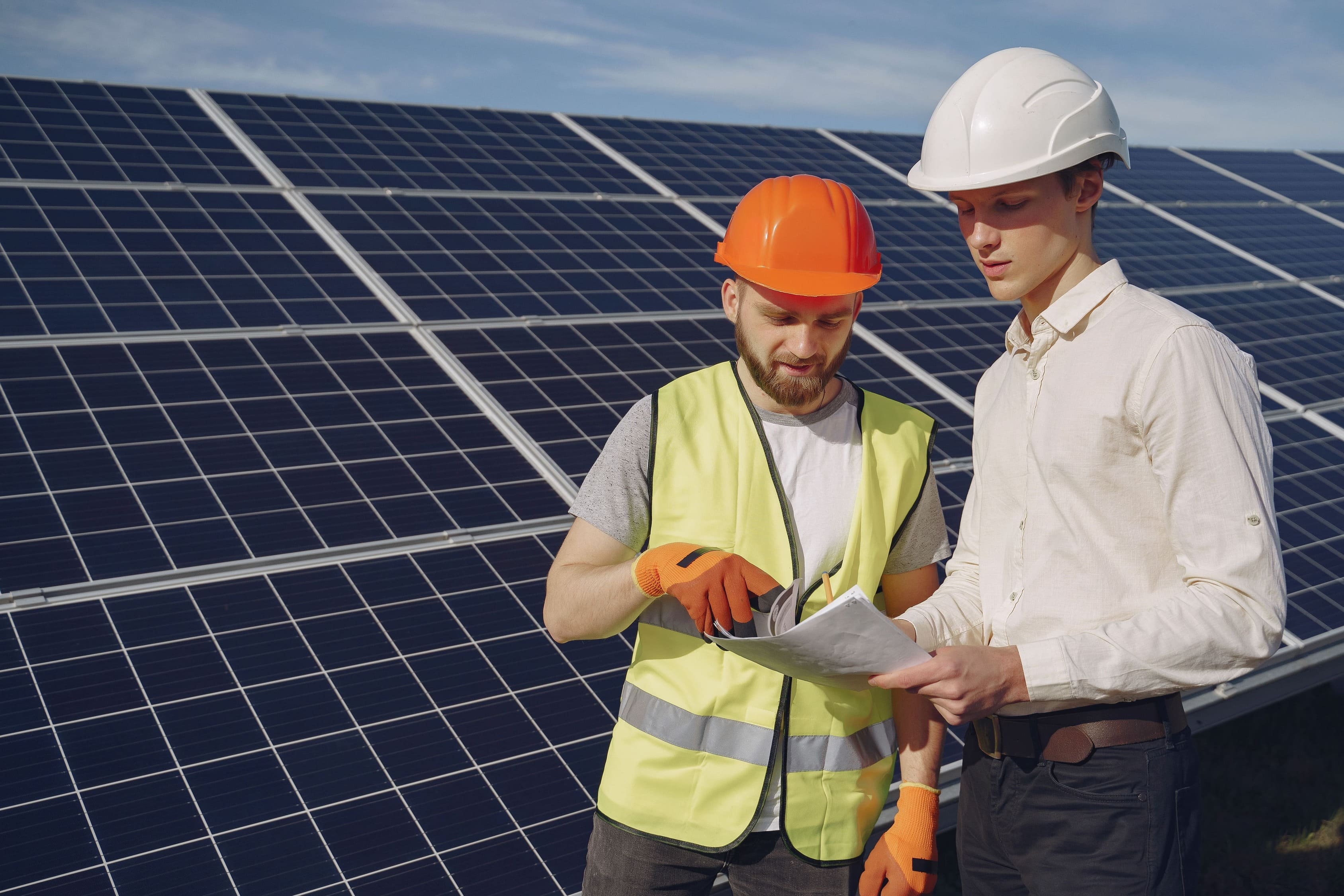 Foreman and businessman at solar energy station