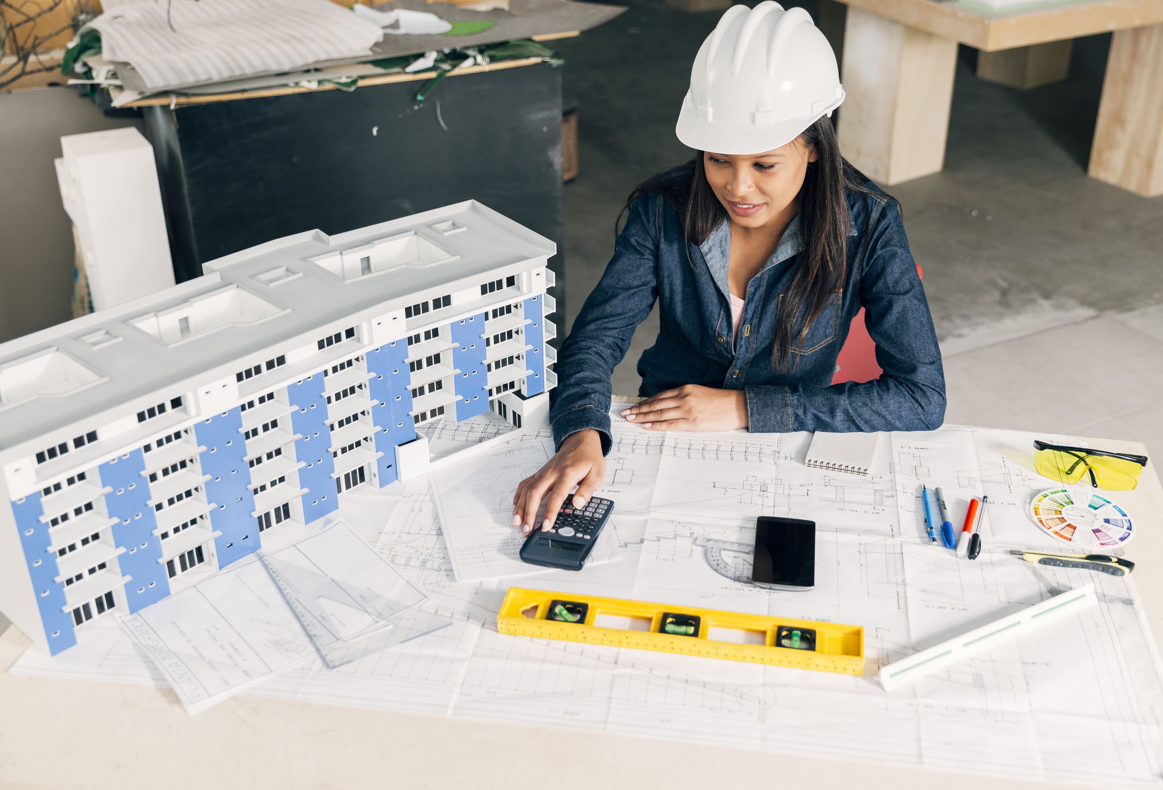 African-american lady in safety helmet