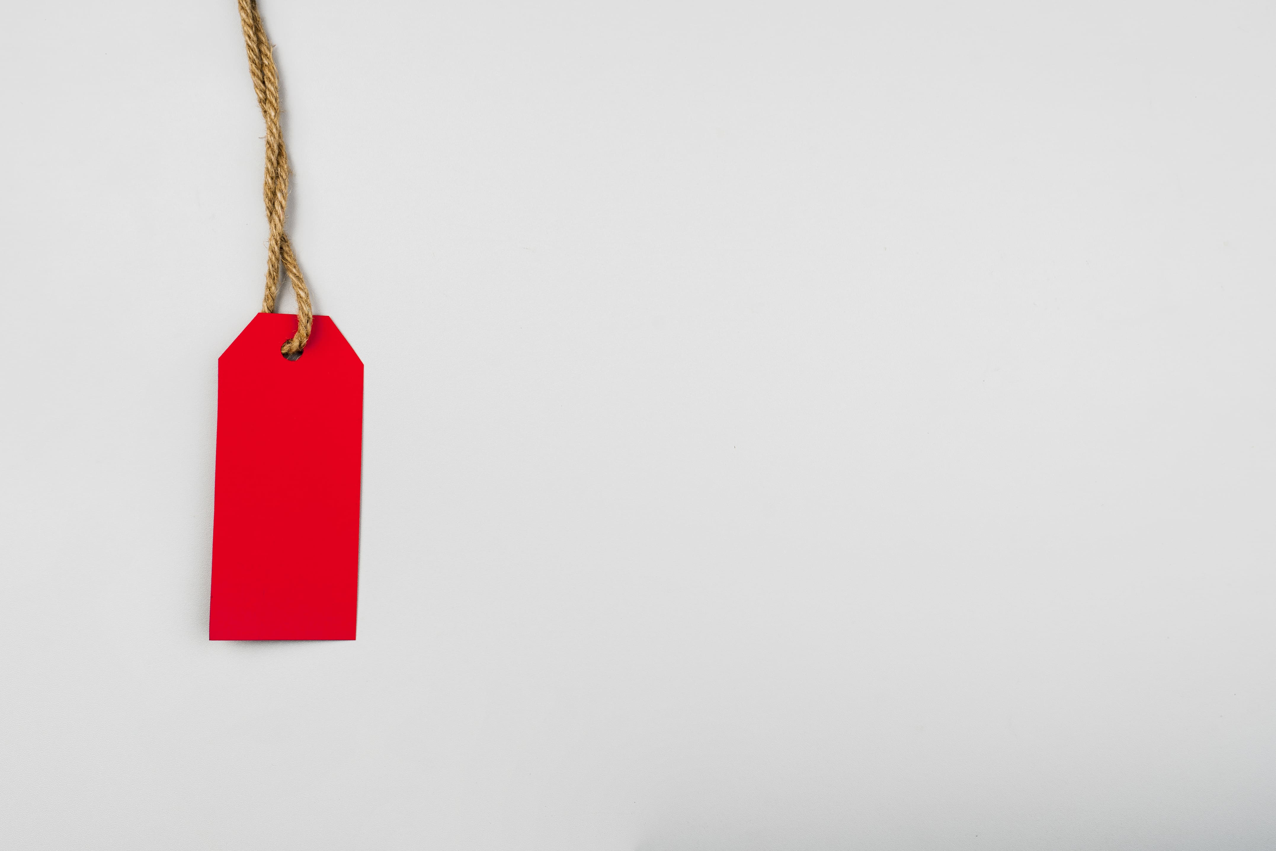 Red label on plain background with copy space