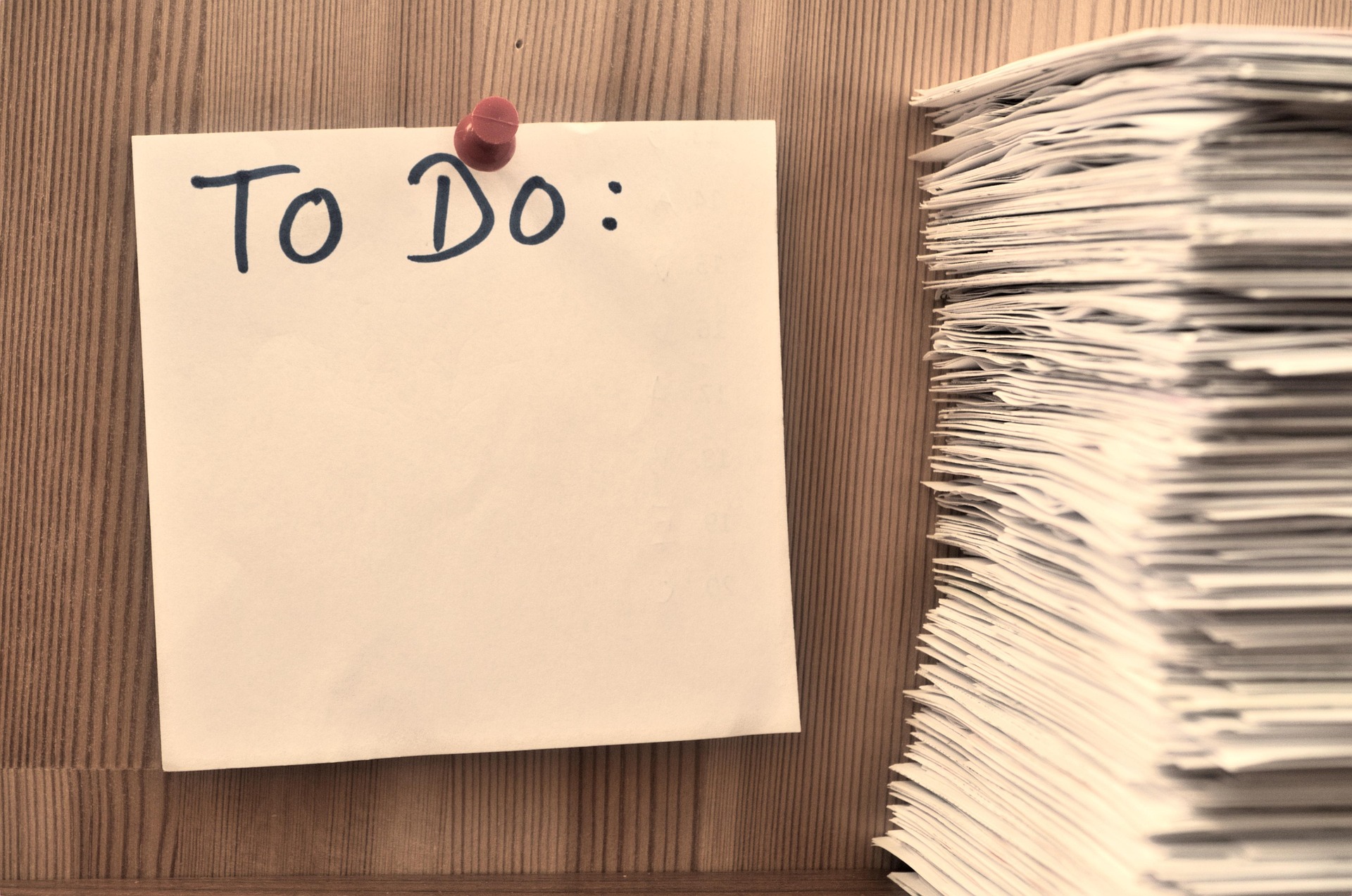 To-Do list with stack of documents