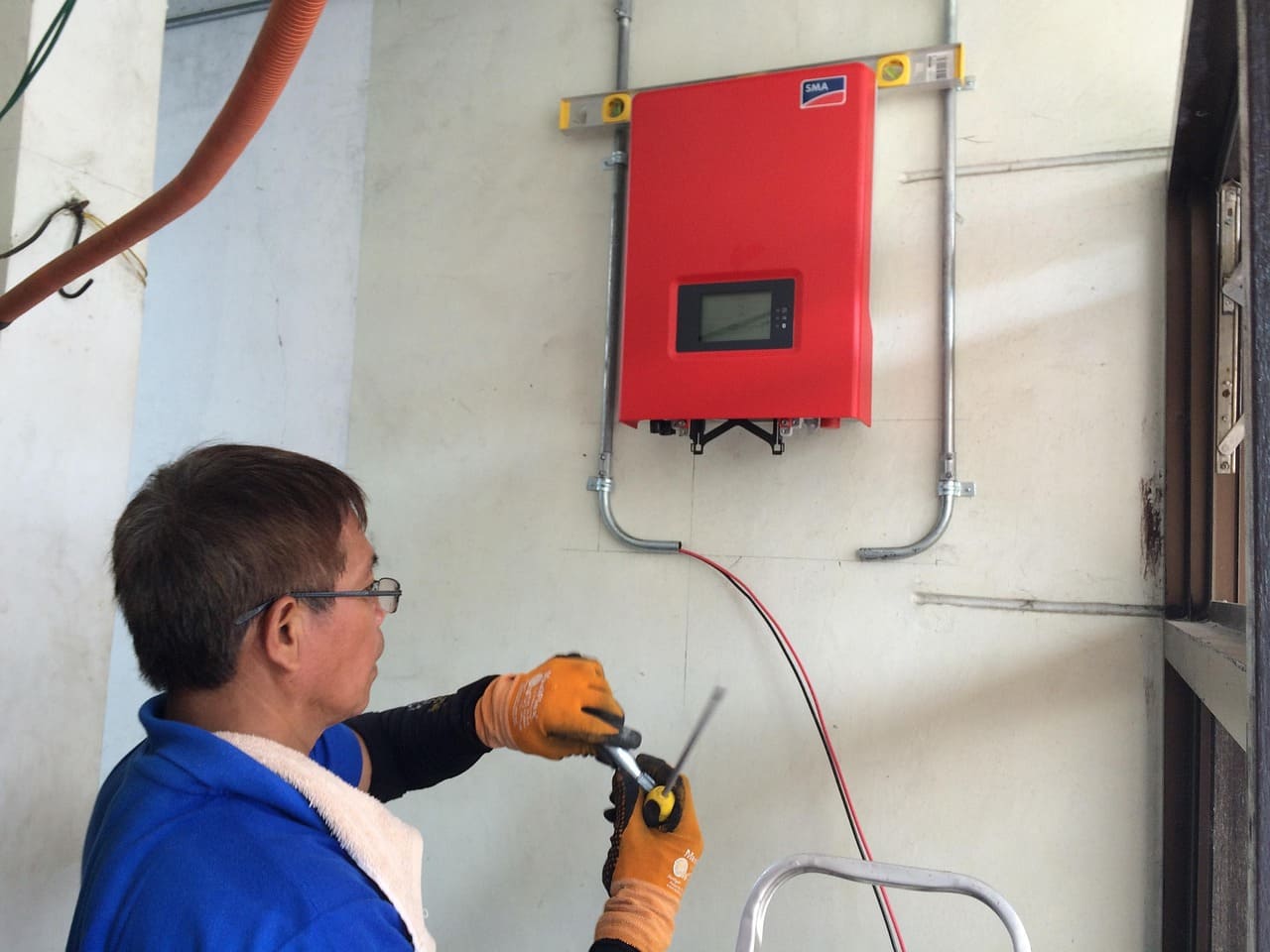 electrician working with an inverter