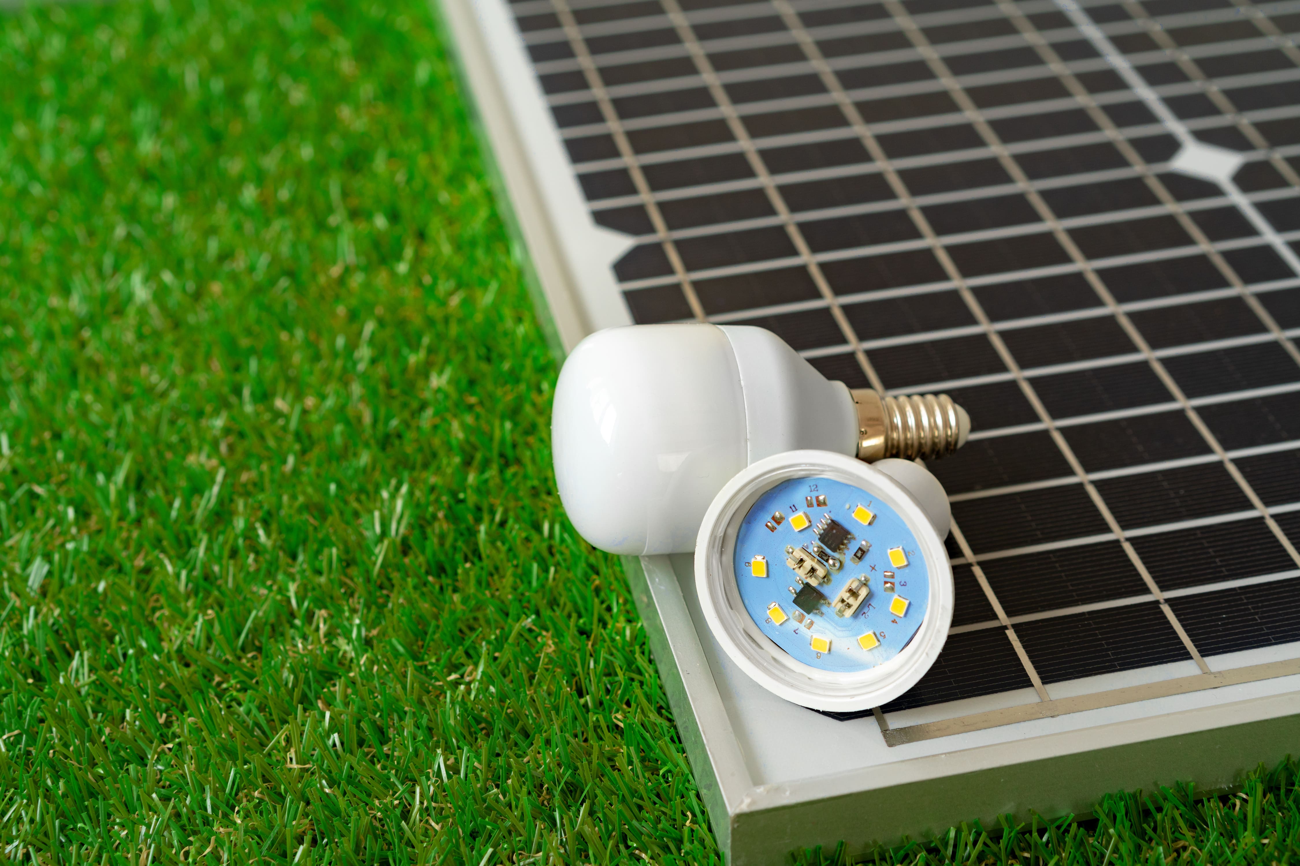 Solar energy panel and light bulb green energy