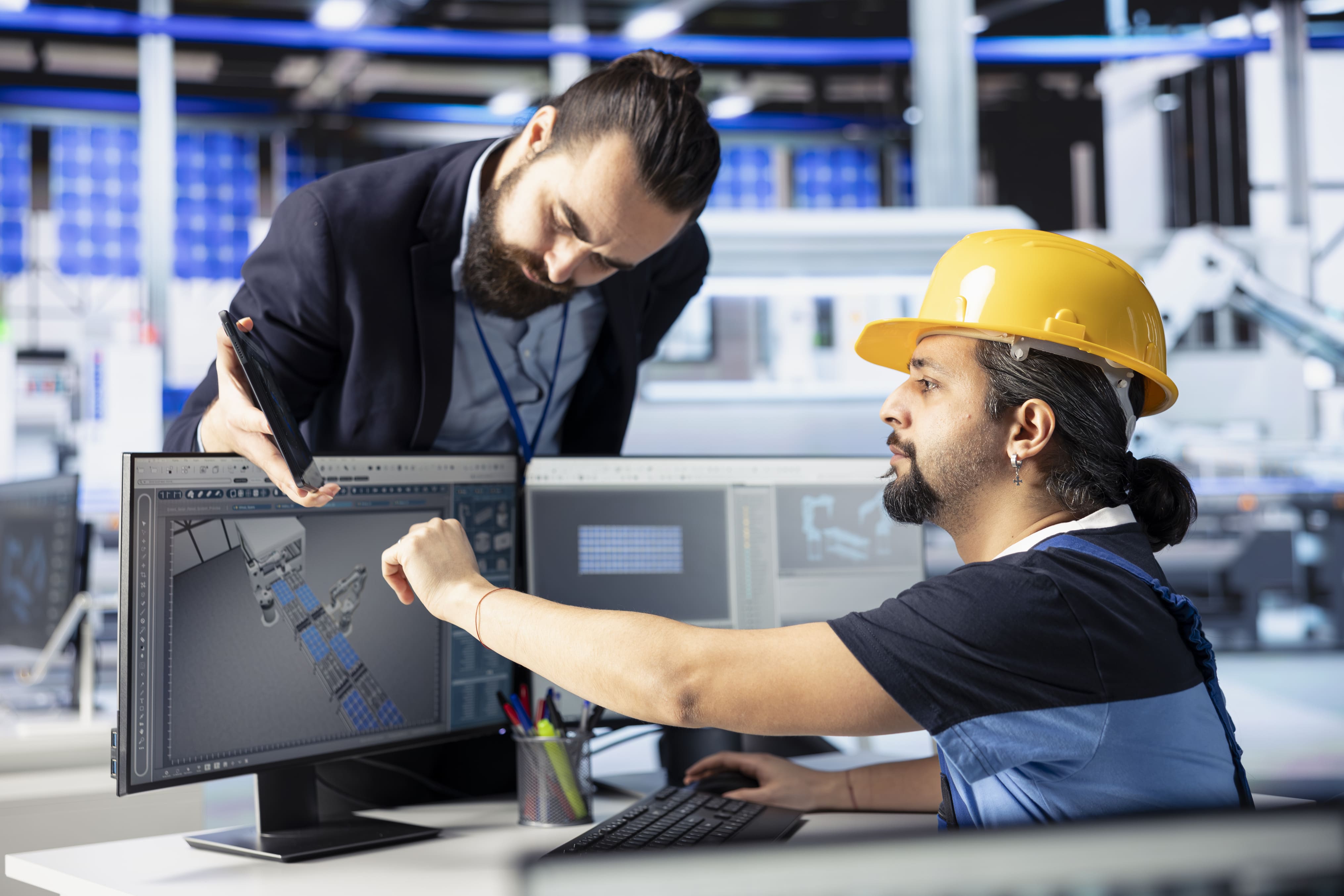 Team leader overseeing work done by man