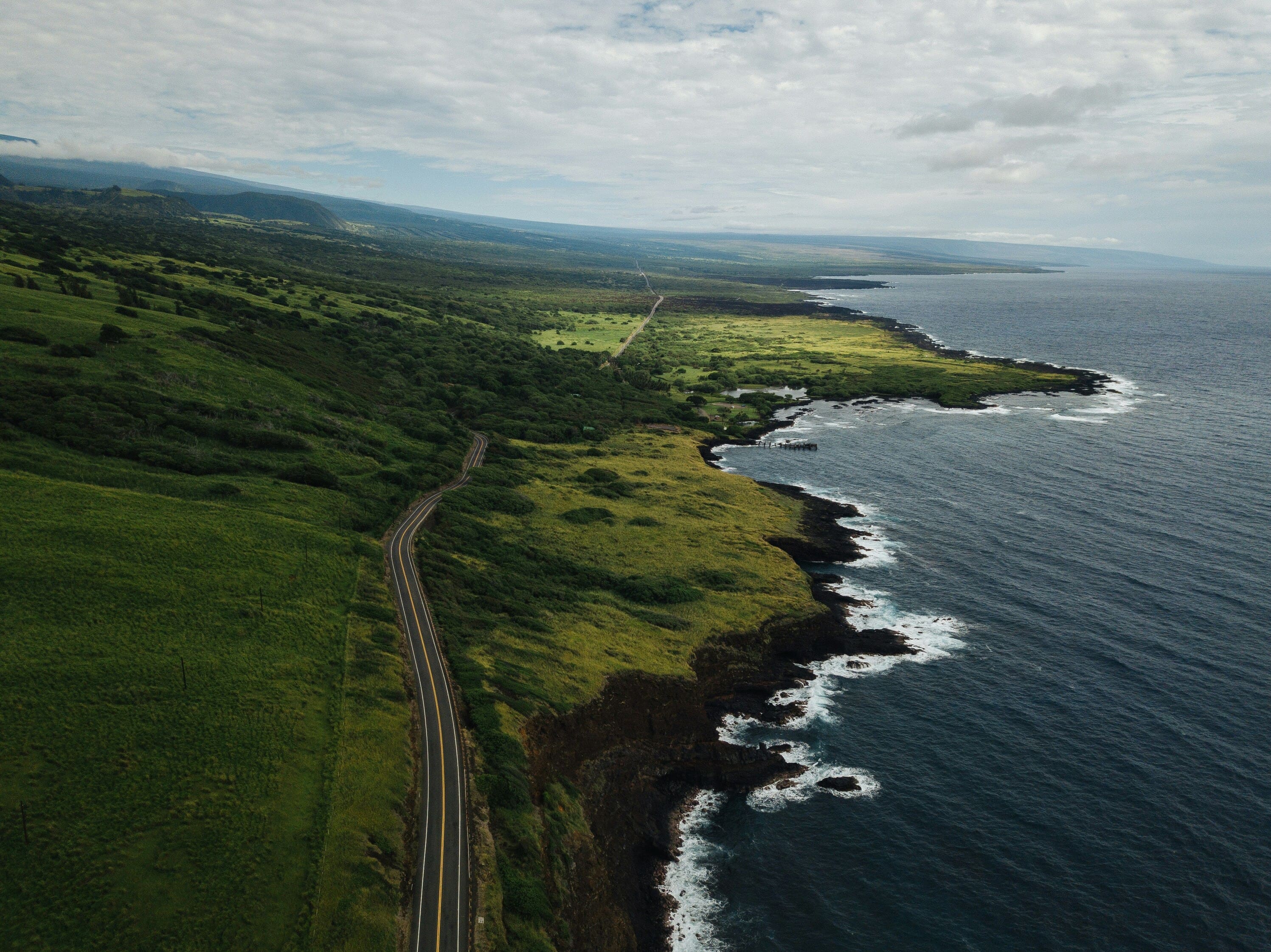Worker installing solar panels on a roof