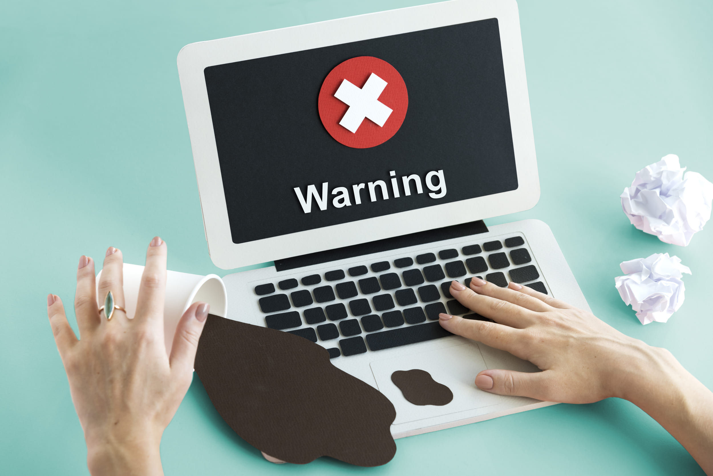 Spilled coffee causes laptop warning screen error