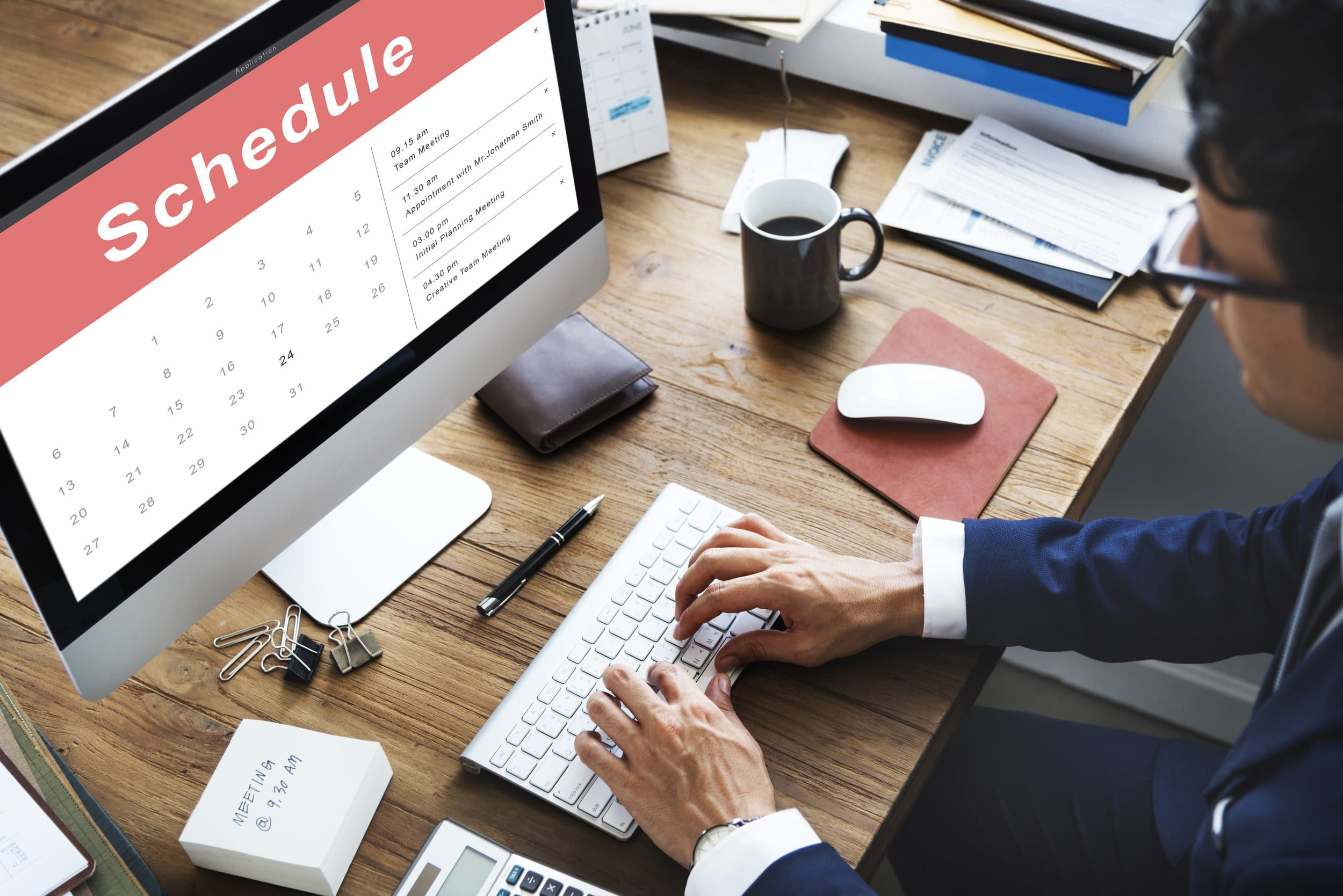 Man schedules appointment using computer calendar software