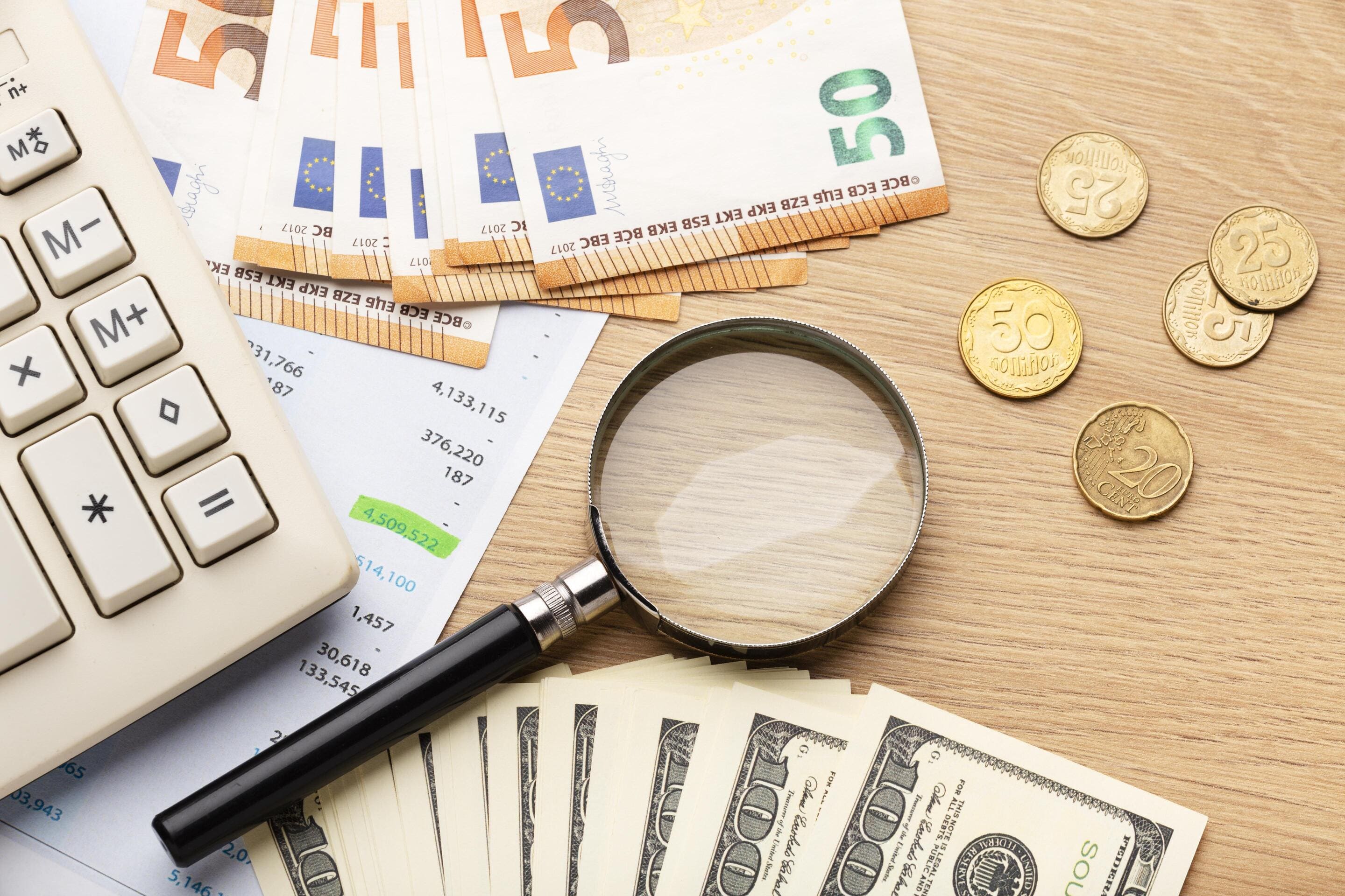 Calculator, Euro, and dollar bills for finance
